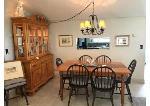 Dining Table with 2 leaves.       Table pads.     Eight chairs.      Matching Hutch